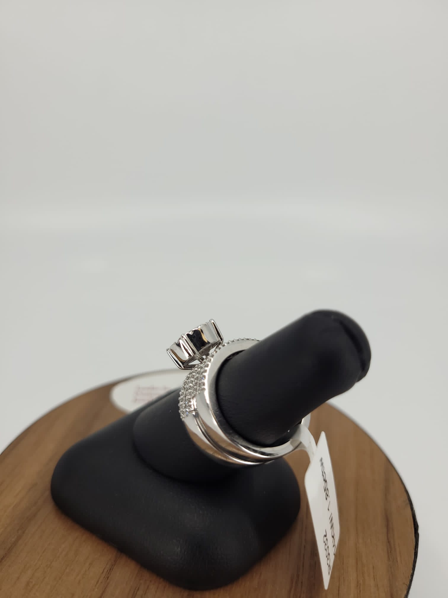 14K White Gold Cluster Setting Engagement Ring with .25 Carat Diamond Center Stone on an Invisible Halo Setting